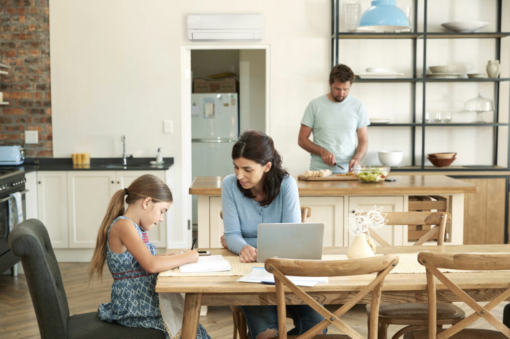 Family in a kitchen with air to air heat pump